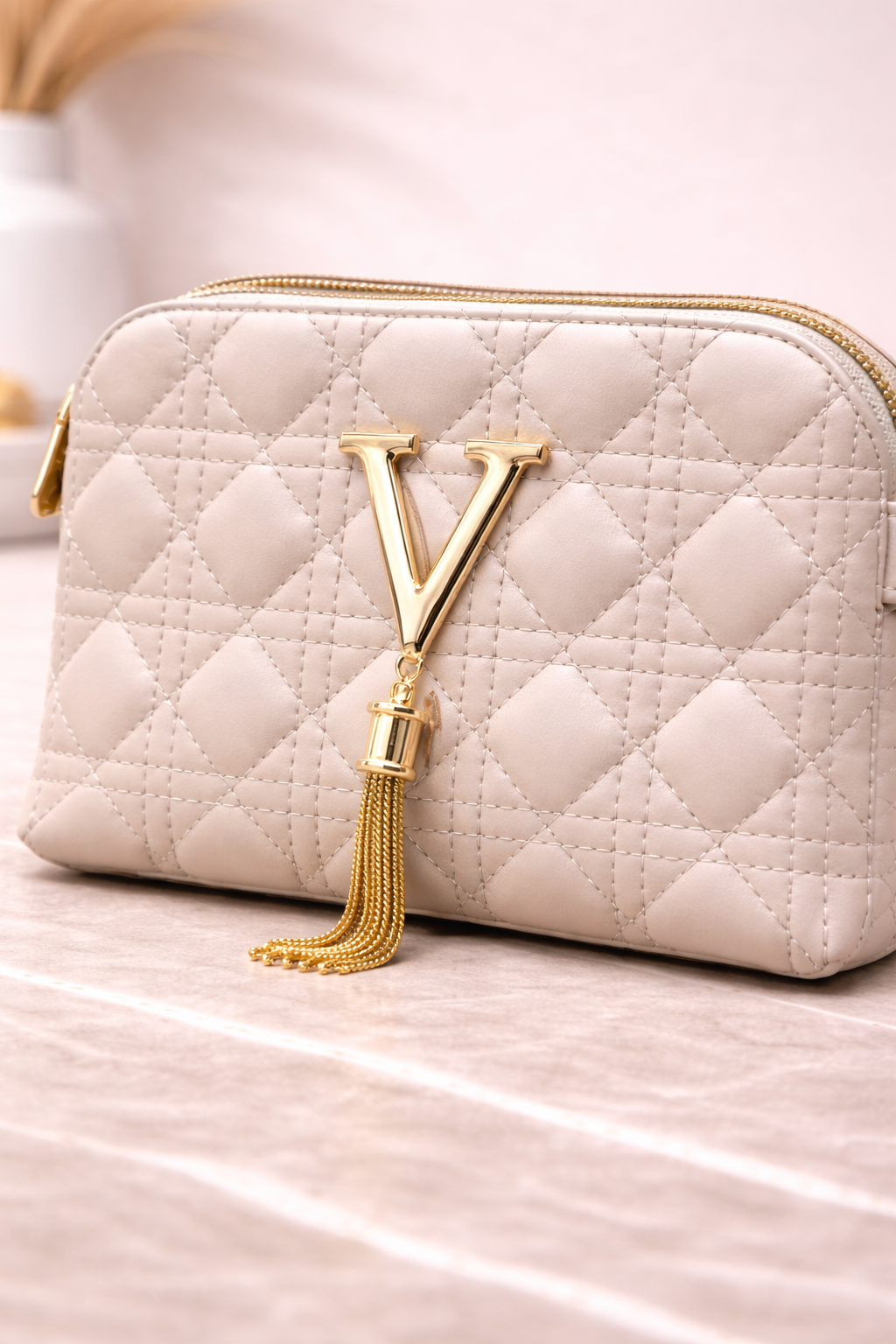 Luxury Off-White Quilted Crossbody Handbag with Gold V Emblem
