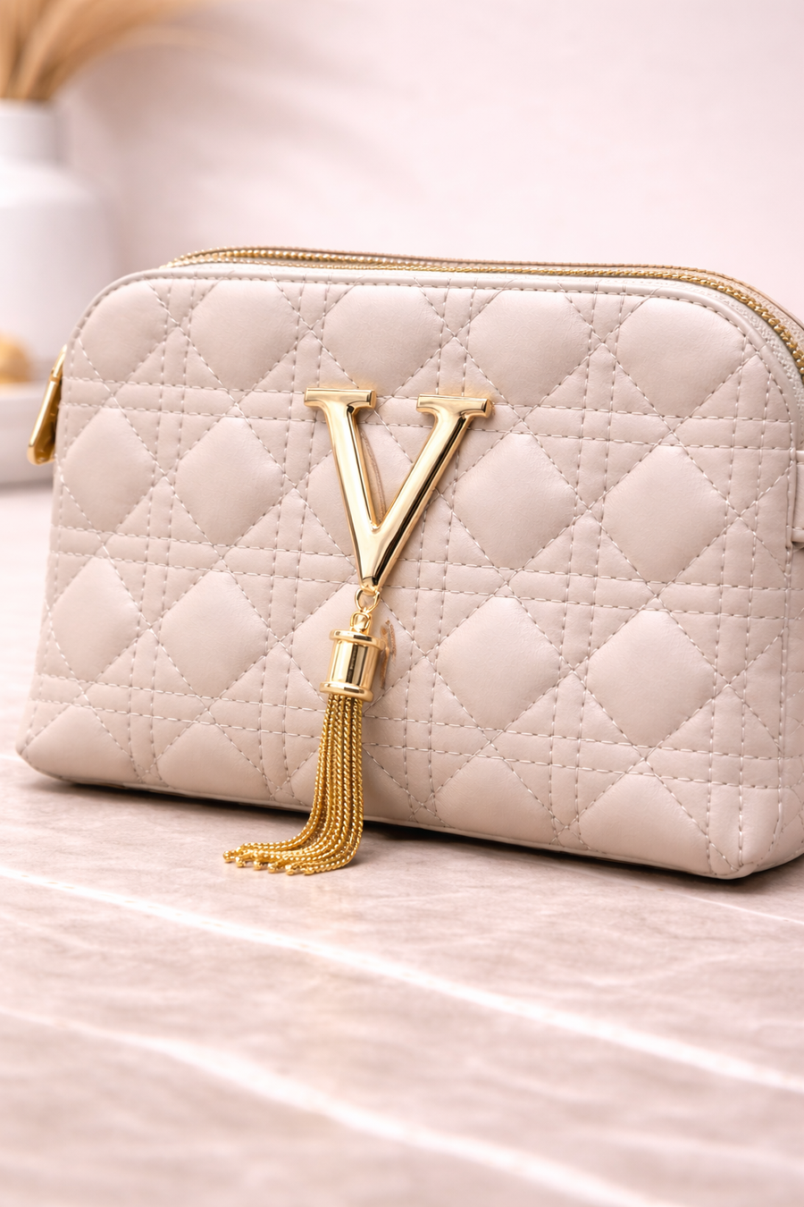 Luxury Off-White Quilted Crossbody Handbag with Gold V Emblem