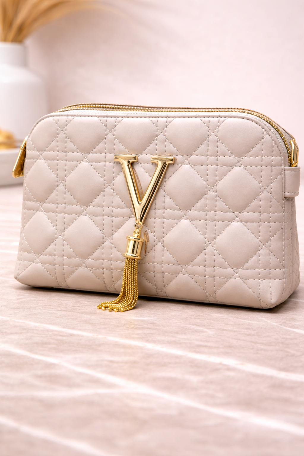 Luxury Off-White Quilted Crossbody Handbag with Gold V Emblem